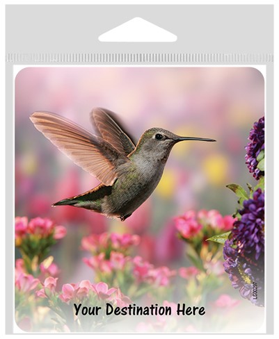 Hummingbird hovering over pink and purple flowers large sticker.